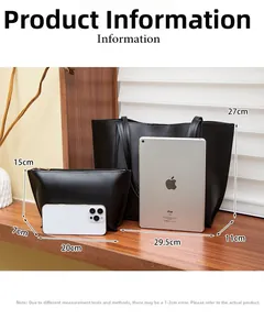 Vue détaillée du grand sac cabas en cuir noir et de sa pochette zippée assortie