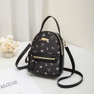Mini sac à dos noir pour femme avec imprimés fleuris roses et détails dorés