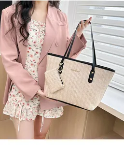 Detailed view of the stylish large capacity straw woven tote bag with matching small pouch