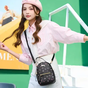 Mini sac à dos noir pour femme avec motifs floraux roses et détails dorés élégants