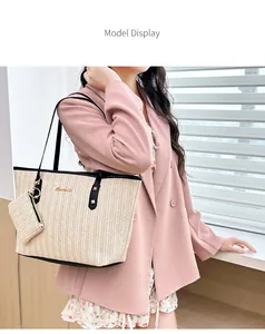 Detail of beige woven straw tote bag featuring black trim and thin shoulder straps