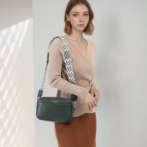 Deep green lychee leather crossbody bag with geometric wide strap for casual fashion