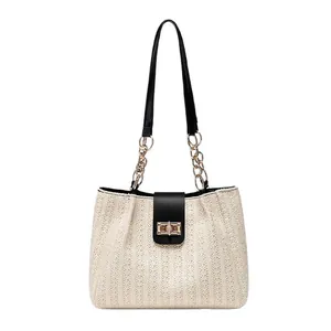 Woven contrast tote bag for women with leather handles and a gold metal buckle closure