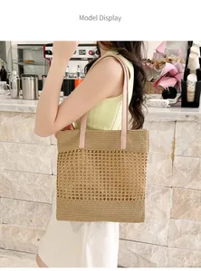 Detail of hand-woven straw tote bag with pink leather handle and hollow mesh pattern
