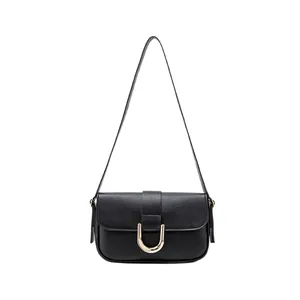 Classic black leather shoulder bag for women with gold horseshoe buckle and adjustable strap