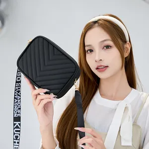 Classic black chevron quilted crossbody bag with adjustable wide lettered shoulder strap