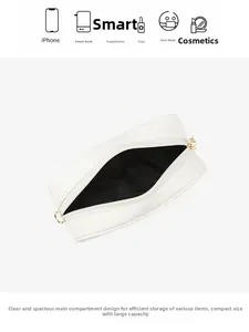 Detail view showing spacious interior of white PU crossbody bag with daily essentials