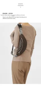 Detail view of brown crossbody bag with letter print and patterned woven shoulder strap