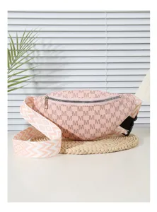 Detail of pink crossbody chest bag with M-letter print and geometric woven strap