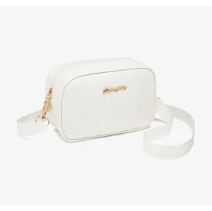 Detail of white wave quilted crossbody bag with gold logo and leaf-shaped zipper puller