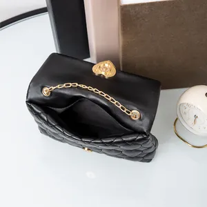 Elegant black quilted shoulder bag with gold heart lock and chain strap for women