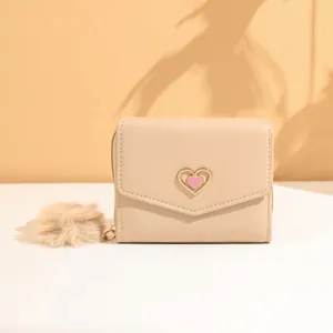 Short beige faux leather tri-fold wallet with pink heart gold trim and pompom charm