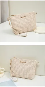Detail of woven beige clutch showing tight V-pattern texture and gold metal zipper