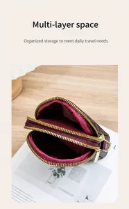 Detail of three-layer crossbody phone bag featuring brown monogram pattern and golden zippers