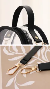 Détail du sac en PVC transparent avec poignée confortable et ferrures dorées brillantes