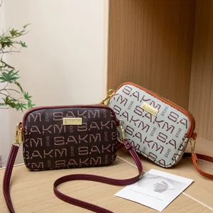 Crossbody bags with SAKMI letter prints in brown and blue with adjustable straps