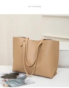 Detailed view of large khaki soft leather tote bag with elegant vertical stitching details