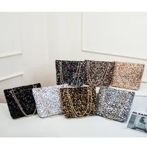 Detail showing various colors of sequin shoulder bags with fine golden chain straps