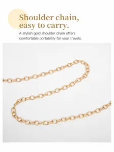 Detailed view of the gold chain shoulder strap featuring interlocking metal oval rings