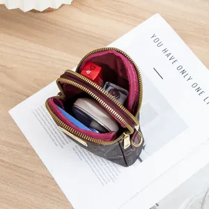 Brown monogram crossbody phone bag with double zipper and multi-layer storage