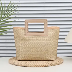Natural straw woven tote bag with beige PU trim and cutout handles for summer leisure