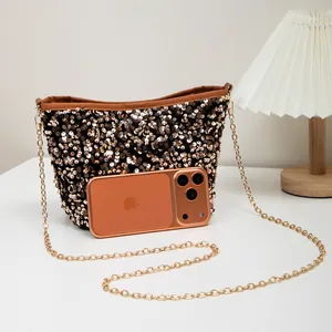 Sparkly sequin crossbody bucket bag with golden chain strap and metallic finish