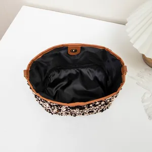 Sparkly sequins bucket bag for women with magnetic closure and golden shimmer finish