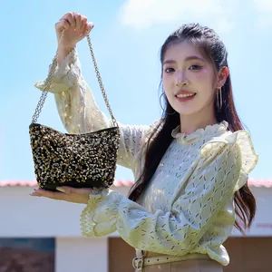 Sparkling sequin shoulder bucket bag with gold chain handle and shiny dual-tone finish