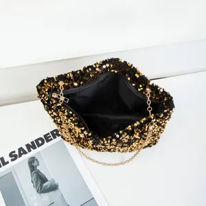 Elegant gold sequin shoulder bag with chain strap and cloud-shaped design for evening