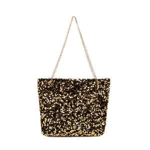 Fashionable black and gold sequin shoulder bag with thin gold chain strap