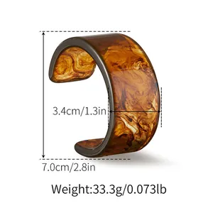 Detailed size specifications for wide acrylic resin cuff bracelet with amber texture