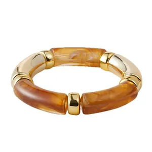 Bohemian stretch beaded bracelet featuring amber marble resin and gold metal tube beads