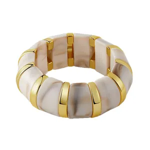 Bohemian elastic bracelet with beige marble acrylic blocks and gold metal spacers