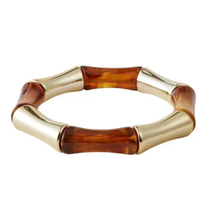 Bracciale elastico retrò in resina ambrata e metallo dorato stile bambù da donna