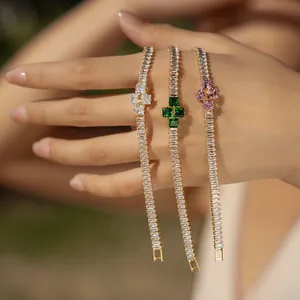 Detailed view of bohemian bracelets with colorful rectangular zircons and 18K gold plating