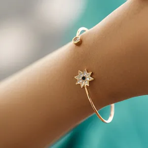 18K gold plated brass open bracelet with blue starburst and zircon accents
