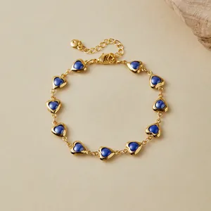 Detailed shot of 18K gold plated bracelet with ten deep blue heart-shaped charms