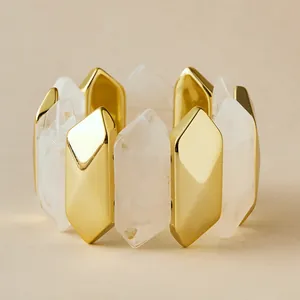 Macro view of geometric acrylic marble texture beads and golden metal stretch bracelet