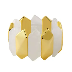 Elastic wide bracelet featuring marbled resin hexagonal prisms and golden metal accents