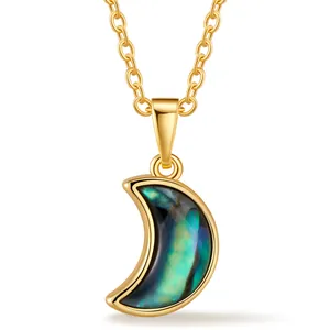 Elegant gold crescent moon necklace with colorful iridescent shell inlay on cross chain