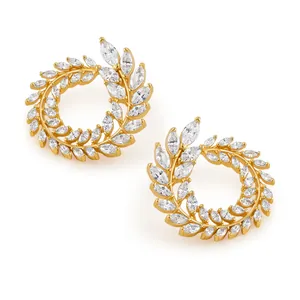 Detailed close-up of golden wreath hoop earrings with marquise-cut zircon leaf accents