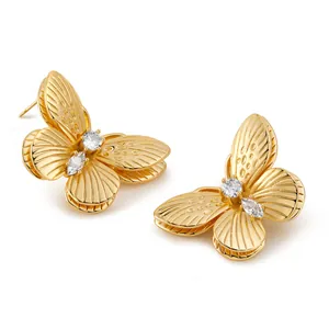 Exquisite 3D golden butterfly stud earrings with sparkling cubic zirconia on white background