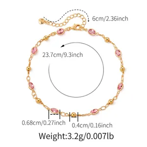 Detailed view of pink teardrop glass stones and gold beads on an 18K plated anklet chain