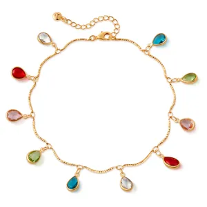 Macro view of gold anklet with ten colorful teardrop charms and a secure lobster clasp