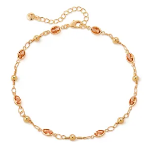 Detail of 18K gold plated anklet with amber teardrop glass stones and beads