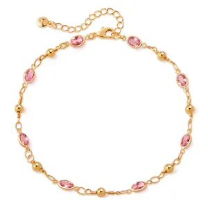 Detailed shot of 18K gold-plated anklet with pink oval gems and lobster clasp