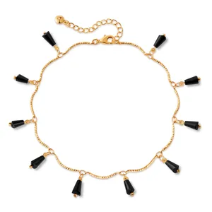 18K gold plated anklet with black cone pendants and lobster clasp on white background