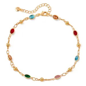 Detail of 18K gold plated anklet with colorful drop-shaped glass stones and lobster clasp