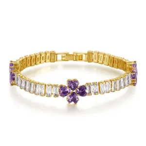 Detailed close-up of 18K gold plated bracelet with purple heart clover and baguette zircons