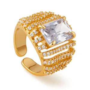 Macro detail of 18K gold ring featuring large rectangular zircon and micro-pave setting